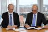 DNV GL's Büssow (left) and Rohaan of VPS sign an agreement of cooperation for the new fuel analytics tool