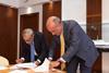 Giuseppe Bono, CEO, Fincantieri and Sandro De Poli, president and CEO, GE Italy agree to develop the Shipboard Pollutant Removal System