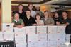 Members of the university research team with some of the data collected from the trials