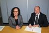 Commercial directors Gary Rodgers of Napier and Sarah Wade of Royston sign the service centre agreement