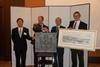 MAN Diesel & Turbo and Kawasaki exchange gifts at the celebrations in Kobe (from left): J. Iki, executive officer & general manager of machinery division; Dr Stephan Timmermann, MAN Diesel & Turbo executive board; Y. Asano, president of gas turb...