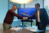 Kongsberg Maritime Sales Director Roger Trinterud (right) and Cor Hoogendoorn, Owner and Director of Holland Shipyard Group, finalize the agreement