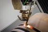 Robotised laser cladding can nearly double the lifetime of a two-stroke piston head, claims QuantiServ