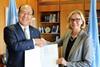 Päivi Luostarinen, permanent representative of Finland to IMO, hands the country's instrument of acceptance to Kitack Lim, secretary general, IMO