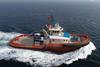 Image of a tug flying a Canadian flag