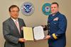 ClassNK executive vice president Dr Takuya Yoneya (L) receives a copy of the recognized organization agreement from U.S. Coast Guard Rear Admiral Joseph A. Servidio (R)