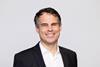 The image shows a headshot of Daniel Bischofberger, CEO of Accelleron smiling at the camera