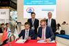 Mr Xu Bin, General Manager of New Dayang Shipbuilding Co., Ltd. (left), and Norbert Kray, DNV GL’s Regional Manager Greater China, signed the JDP at DNV GL's Nor-Shipping stand.