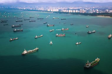 Vessels berthing at Singapore, the world’s largest bunkering hub and busiest container port globally