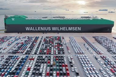 Wallenius Wilhelmsen PCTC at port with rows of cargo