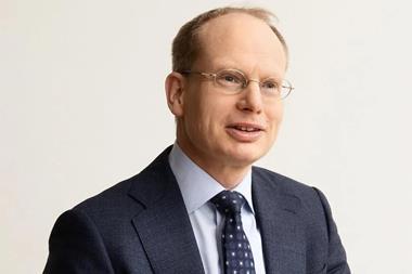 A head and shoulders image of Mr Agnevell, dressed in a blue suit, blue tie and white shirt