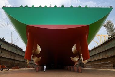 AkzoNobel's Intersleek hull coating. Underside view of a ship in a dry dock after application of new hull coating.