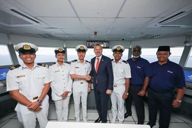 The image shows the inauguration of the Wärtsilä simulation suite at ALAM