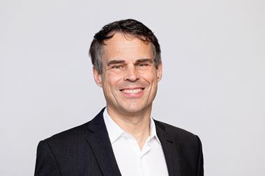The image shows a headshot of Daniel Bischofberger, CEO of Accelleron smiling at the camera