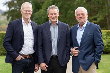 The image shows Kim Bengtsen, Henrik Sørensen and Søren Ø. Sørensen smiling at the camera