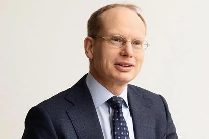 A head and shoulders image of Mr Agnevell, dressed in a blue suit, blue tie and white shirt