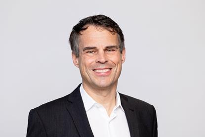 The image shows a headshot of Daniel Bischofberger, CEO of Accelleron smiling at the camera