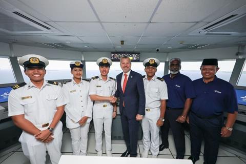 The image shows the inauguration of the Wärtsilä simulation suite at ALAM