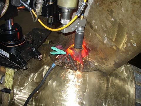 Seized variable pitched propeller blade stud being removed to enable replacement of seals