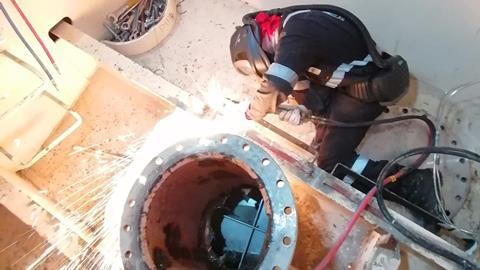Hydrex diver/welder during installation of a new scrubber pipe.