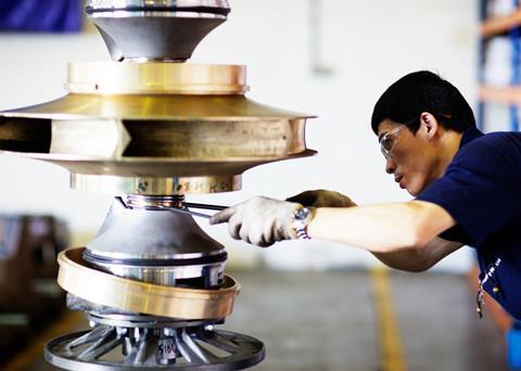Working on a cargo pump at Hamworthy's Far Eastern facility