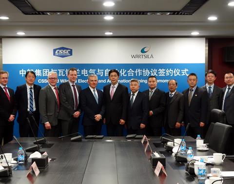 Jaakko Eskola, CEO of Wärtsilä (centre left) and Wu Qiang, president of CSSC (centre right) sign the letter of intent for the companies' fourth joint venture