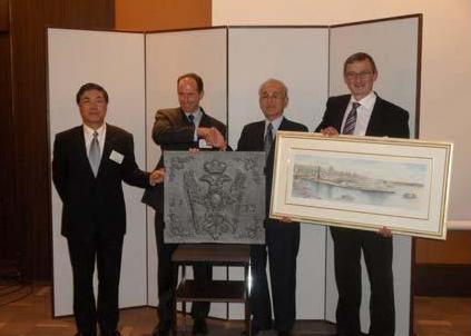 MAN Diesel & Turbo and Kawasaki exchange gifts at the celebrations in Kobe (from left): J. Iki, executive officer & general manager of machinery division; Dr Stephan Timmermann, MAN Diesel & Turbo executive board; Y. Asano, president of gas turb...
