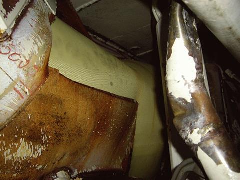 Torn hull pictured from inside showing watertight Miko fabric patch