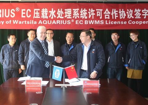 Joe Thomas, director, BWMS, Wärtsilä Marine Solutions and Zou Xiubin, director, Jiujiang Precision Measuring Technology Research Institute sign the license agreement