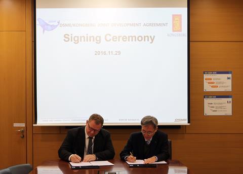 Tore Wean, managing director, Kongsberg Maritime Korea (left) and Young Bok Choi, Vice President at DSME Naval & Energy System R&D, ink the agreement